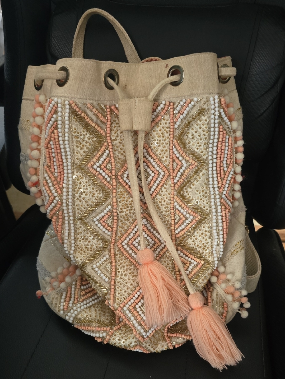 America & Beyond Beaded Tassel Drawstring Backpack - Peach Pink, Neutral & Gold
